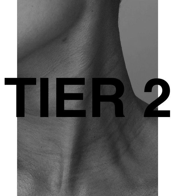 Alt text: Tier 2 skin subscription at Ashleigh Hasson, a non-surgical skin aesthetics studio in Darling Point, Sydney—black and white close-up of fine lines on the neck and under the chin, emphasising skin texture and rejuvenation treatments.